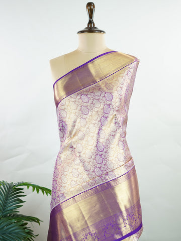 Kanchipuram Silk Beautiful bridal Kanjivaram Tissue saree featuring a luminous Lavender body, gracefully complemented by a matching Lavender border and elegant pallu. The delicate tissue weave adds a radiant shimmer, enhancing the saree’s luxurious and ethereal appeal. Expertly crafted with timeless Kanjivaram artistry, this drape exudes sophistication, grace, and bridal elegance. Paired with a matching Tissue Lavender blouse, it is a perfect choice for weddings, receptions, and grand celebrations. Ishvika 