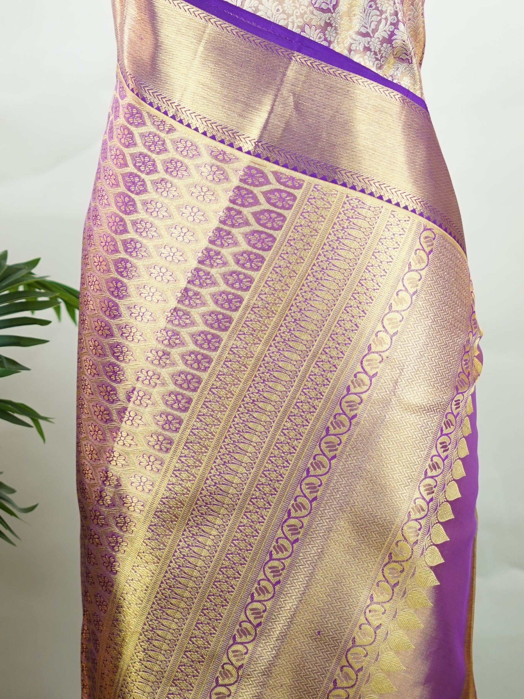 Kanchipuram Silk Beautiful bridal Kanjivaram Tissue saree featuring a luminous Lavender body, gracefully complemented by a matching Lavender border and elegant pallu. The delicate tissue weave adds a radiant shimmer, enhancing the saree’s luxurious and ethereal appeal. Expertly crafted with timeless Kanjivaram artistry, this drape exudes sophistication, grace, and bridal elegance. Paired with a matching Tissue Lavender blouse, it is a perfect choice for weddings, receptions, and grand celebrations. Ishvika 