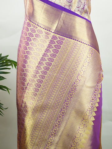 Kanchipuram Silk Beautiful bridal Kanjivaram Tissue saree featuring a luminous Lavender body, gracefully complemented by a matching Lavender border and elegant pallu. The delicate tissue weave adds a radiant shimmer, enhancing the saree’s luxurious and ethereal appeal. Expertly crafted with timeless Kanjivaram artistry, this drape exudes sophistication, grace, and bridal elegance. Paired with a matching Tissue Lavender blouse, it is a perfect choice for weddings, receptions, and grand celebrations. Ishvika 