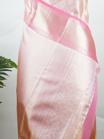 Kanchipuram Silk Beautiful bridal Kanjivaram saree featuring a delicate Pastel Pink body, elegantly paired with a matching border, pallu, and blouse. The soft pastel hue radiates grace and romance, creating a timeless and sophisticated bridal look. Exquisitely woven with traditional Kanjivaram craftsmanship, the saree blends heritage charm with modern elegance. A stunning choice for weddings and special celebrations, this enchanting drape embodies beauty, refinement, and bridal splendor. Darsitha - Pure Kan