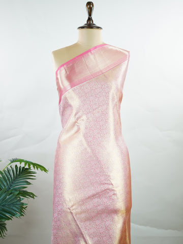 Kanchipuram Silk Beautiful bridal Kanjivaram saree featuring a delicate Pastel Pink body, elegantly paired with a matching border, pallu, and blouse. The soft pastel hue radiates grace and romance, creating a timeless and sophisticated bridal look. Exquisitely woven with traditional Kanjivaram craftsmanship, the saree blends heritage charm with modern elegance. A stunning choice for weddings and special celebrations, this enchanting drape embodies beauty, refinement, and bridal splendor. Darsitha - Pure Kan