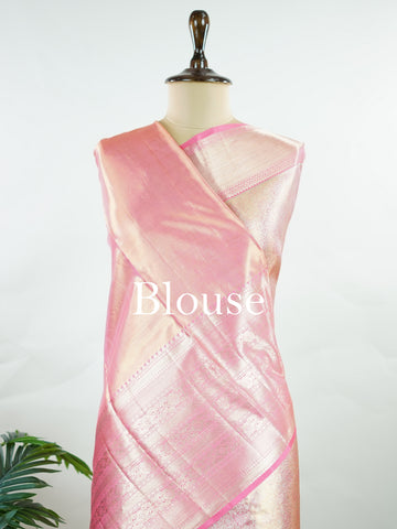 Kanchipuram Silk Beautiful bridal Kanjivaram saree featuring a delicate Pastel Pink body, elegantly paired with a matching border, pallu, and blouse. The soft pastel hue radiates grace and romance, creating a timeless and sophisticated bridal look. Exquisitely woven with traditional Kanjivaram craftsmanship, the saree blends heritage charm with modern elegance. A stunning choice for weddings and special celebrations, this enchanting drape embodies beauty, refinement, and bridal splendor. Darsitha - Pure Kan