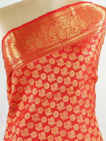Kanchipuram Silk A radiant red Kanchipuram silk, embellished with delicate gold zari buttas across its expanse. The self-border adds understated grace, perfect for bridal elegance and festive occasions. This timeless weave reflects the grandeur of South Indian handloom heritage.     #ManoranjithamSilks #KanjivaramHandloom #PureSilkSaree #BridalElegance #TimelessTradition Harikambhoji - Pure Kanjivaram Silk Saree | Zari Buttas - Manoranjitham Weaves - Handloom Store