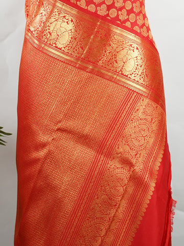 Kanchipuram Silk A radiant red Kanchipuram silk, embellished with delicate gold zari buttas across its expanse. The self-border adds understated grace, perfect for bridal elegance and festive occasions. This timeless weave reflects the grandeur of South Indian handloom heritage.     #ManoranjithamSilks #KanjivaramHandloom #PureSilkSaree #BridalElegance #TimelessTradition Harikambhoji - Pure Kanjivaram Silk Saree | Zari Buttas - Manoranjitham Weaves - Handloom Store