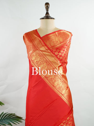 Kanchipuram Silk A radiant red Kanchipuram silk, embellished with delicate gold zari buttas across its expanse. The self-border adds understated grace, perfect for bridal elegance and festive occasions. This timeless weave reflects the grandeur of South Indian handloom heritage.     #ManoranjithamSilks #KanjivaramHandloom #PureSilkSaree #BridalElegance #TimelessTradition Harikambhoji - Pure Kanjivaram Silk Saree | Zari Buttas - Manoranjitham Weaves - Handloom Store
