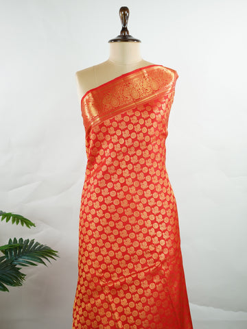 Kanchipuram Silk A radiant red Kanchipuram silk, embellished with delicate gold zari buttas across its expanse. The self-border adds understated grace, perfect for bridal elegance and festive occasions. This timeless weave reflects the grandeur of South Indian handloom heritage.     #ManoranjithamSilks #KanjivaramHandloom #PureSilkSaree #BridalElegance #TimelessTradition Harikambhoji - Pure Kanjivaram Silk Saree | Zari Buttas - Manoranjitham Weaves - Handloom Store