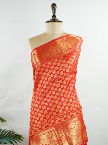 Kanchipuram Silk A radiant red Kanchipuram silk, embellished with delicate gold zari buttas across its expanse. The self-border adds understated grace, perfect for bridal elegance and festive occasions. This timeless weave reflects the grandeur of South Indian handloom heritage.     #ManoranjithamSilks #KanjivaramHandloom #PureSilkSaree #BridalElegance #TimelessTradition Harikambhoji - Pure Kanjivaram Silk Saree | Zari Buttas - Manoranjitham Weaves - Handloom Store