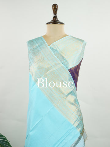 Kanchipuram Silk A regal burgundy Kanchipuram silk saree, woven from 100% pure silk with shimmering gold zari buttas adorning its body. The striking cyan border adds a vibrant contrast, making this drape perfect for grand occasions. Every weave echoes timeless tradition and handloom excellence. The rich hues speak of royal heritage, while the intricate zari work whispers stories of artisanal mastery. A timeless piece, crafted to grace your most cherished moments.          #ManoranjithamSilks #KanjivaramHand