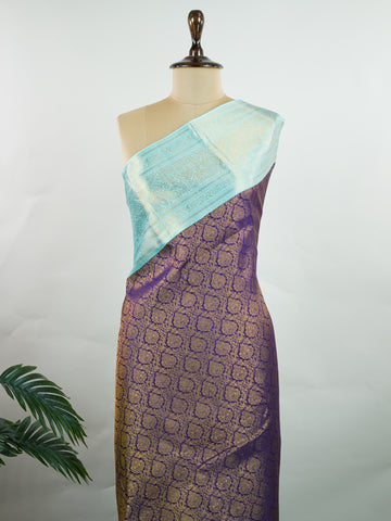 Kanchipuram Silk A regal burgundy Kanchipuram silk saree, woven from 100% pure silk with shimmering gold zari buttas adorning its body. The striking cyan border adds a vibrant contrast, making this drape perfect for grand occasions. Every weave echoes timeless tradition and handloom excellence. The rich hues speak of royal heritage, while the intricate zari work whispers stories of artisanal mastery. A timeless piece, crafted to grace your most cherished moments.          #ManoranjithamSilks #KanjivaramHand