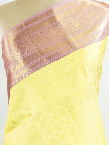 Kanchipuram Silk A radiant yellow Kanchipuram silk saree embellished with gold zari buttas, capturing the warmth of sunlight in every weave. The pink border adds a playful contrast, making it perfect for auspicious celebrations. Crafted from 100% pure silk, this handloom treasure carries the essence of timeless tradition. A saree designed to grace festive moments and bridal occasions.      #ManoranjithamSilks #KanjivaramHandloom #PureSilkSaree #BridalElegance #TimelessTradition Sarasangi - Pure Kanjivaram S