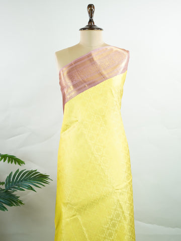 Kanchipuram Silk A radiant yellow Kanchipuram silk saree embellished with gold zari buttas, capturing the warmth of sunlight in every weave. The pink border adds a playful contrast, making it perfect for auspicious celebrations. Crafted from 100% pure silk, this handloom treasure carries the essence of timeless tradition. A saree designed to grace festive moments and bridal occasions.      #ManoranjithamSilks #KanjivaramHandloom #PureSilkSaree #BridalElegance #TimelessTradition Sarasangi - Pure Kanjivaram S