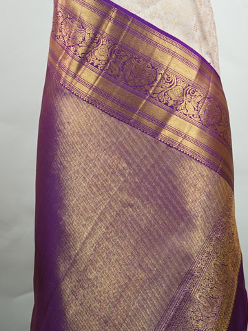 Kanchipuram Silk A soft peach Kanchipuram silk saree adorned with gold zari buttas, exuding subtle grace. The deep burgundy border offers a striking contrast, elevating the timeless beauty of this weave. Woven from 100% pure silk, this saree blends tradition with understated luxury. Ideal for weddings and festive occasions.         #ManoranjithamSilks #KanjivaramHandloom #PureSilkSaree #BridalElegance #TimelessTradition Sahana - Pure Kanjivaram Silk Saree | Zari Buttas - Manoranjitham Weaves - Handloom Stor