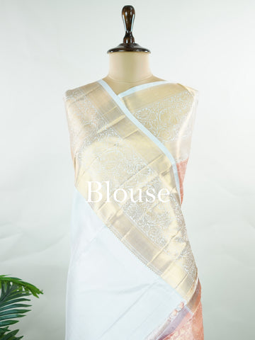 Kanchipuram Silk A captivating coral Kanchipuram silk saree woven with gold zari buttas, radiating charm and grace. The contrast lavender border adds a gentle elegance to the weave. Crafted from 100% pure silk, this timeless creation is perfect for weddings and festive moments.            #ManoranjithamSilks #KanjivaramHandloom #PureSilkSaree #BridalElegance #TimelessTradition Pantuvarali - Pure Kanjivaram Silk Saree | Zari Buttas - Manoranjitham Weaves - Handloom Store