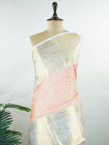 Kanchipuram Silk A captivating coral Kanchipuram silk saree woven with gold zari buttas, radiating charm and grace. The contrast lavender border adds a gentle elegance to the weave. Crafted from 100% pure silk, this timeless creation is perfect for weddings and festive moments.            #ManoranjithamSilks #KanjivaramHandloom #PureSilkSaree #BridalElegance #TimelessTradition Pantuvarali - Pure Kanjivaram Silk Saree | Zari Buttas - Manoranjitham Weaves - Handloom Store