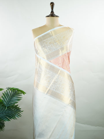 Kanchipuram Silk A captivating coral Kanchipuram silk saree woven with gold zari buttas, radiating charm and grace. The contrast lavender border adds a gentle elegance to the weave. Crafted from 100% pure silk, this timeless creation is perfect for weddings and festive moments.            #ManoranjithamSilks #KanjivaramHandloom #PureSilkSaree #BridalElegance #TimelessTradition Pantuvarali - Pure Kanjivaram Silk Saree | Zari Buttas - Manoranjitham Weaves - Handloom Store