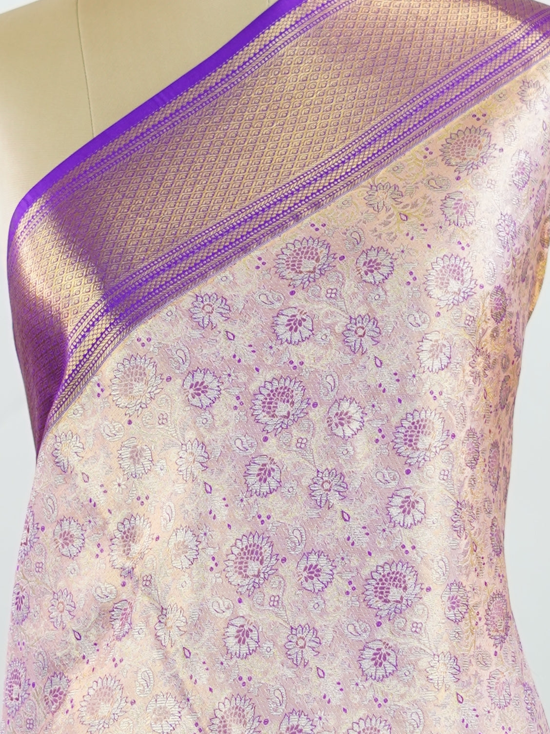 Kanchipuram Silk Soft peach silk meets purple borders, woven with gold and silver zari buttas that shimmer in every glance. This saree blends grace with tradition, perfect for festive moments. Crafted from 100% pure silk, it carries the artistry of timeless handlooms. A drape to cherish forever.                #ManoranjithamSilks #KanjivaramHandloom #PureSilkSaree #BridalElegance #TimelessTradition Sindhu - Peach Pure Kanjivaram Silk Saree | Zari Buttas - Manoranjitham Weaves - Handloom Store