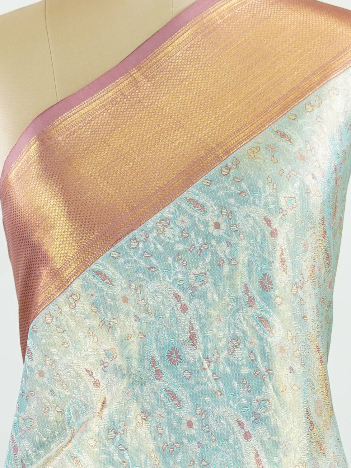 Kanchipuram Silk Earthy olive green silk paired with red borders, woven with gold and silver zari buttas that glimmer softly. This saree blends tradition with understated elegance. Made from 100% pure silk, it speaks of timeless beauty. A perfect drape for weddings and special occasions.            #ManoranjithamSilks #KanjivaramHandloom #PureSilkSaree #BridalElegance #TimelessTradition Gowrimanohari - Green Pure Kanjivaram Silk Saree | Zari Buttas - Manoranjitham Weaves - Handloom Store