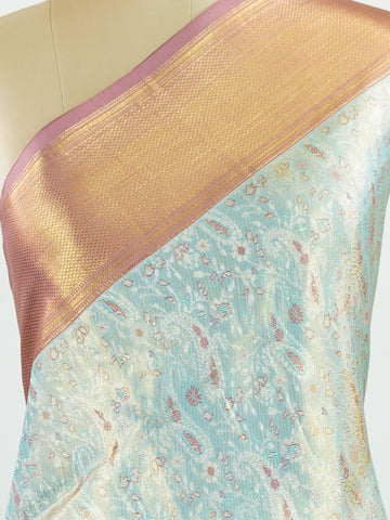 Kanchipuram Silk Earthy olive green silk paired with red borders, woven with gold and silver zari buttas that glimmer softly. This saree blends tradition with understated elegance. Made from 100% pure silk, it speaks of timeless beauty. A perfect drape for weddings and special occasions.            #ManoranjithamSilks #KanjivaramHandloom #PureSilkSaree #BridalElegance #TimelessTradition Gowrimanohari - Green Pure Kanjivaram Silk Saree | Zari Buttas - Manoranjitham Weaves - Handloom Store
