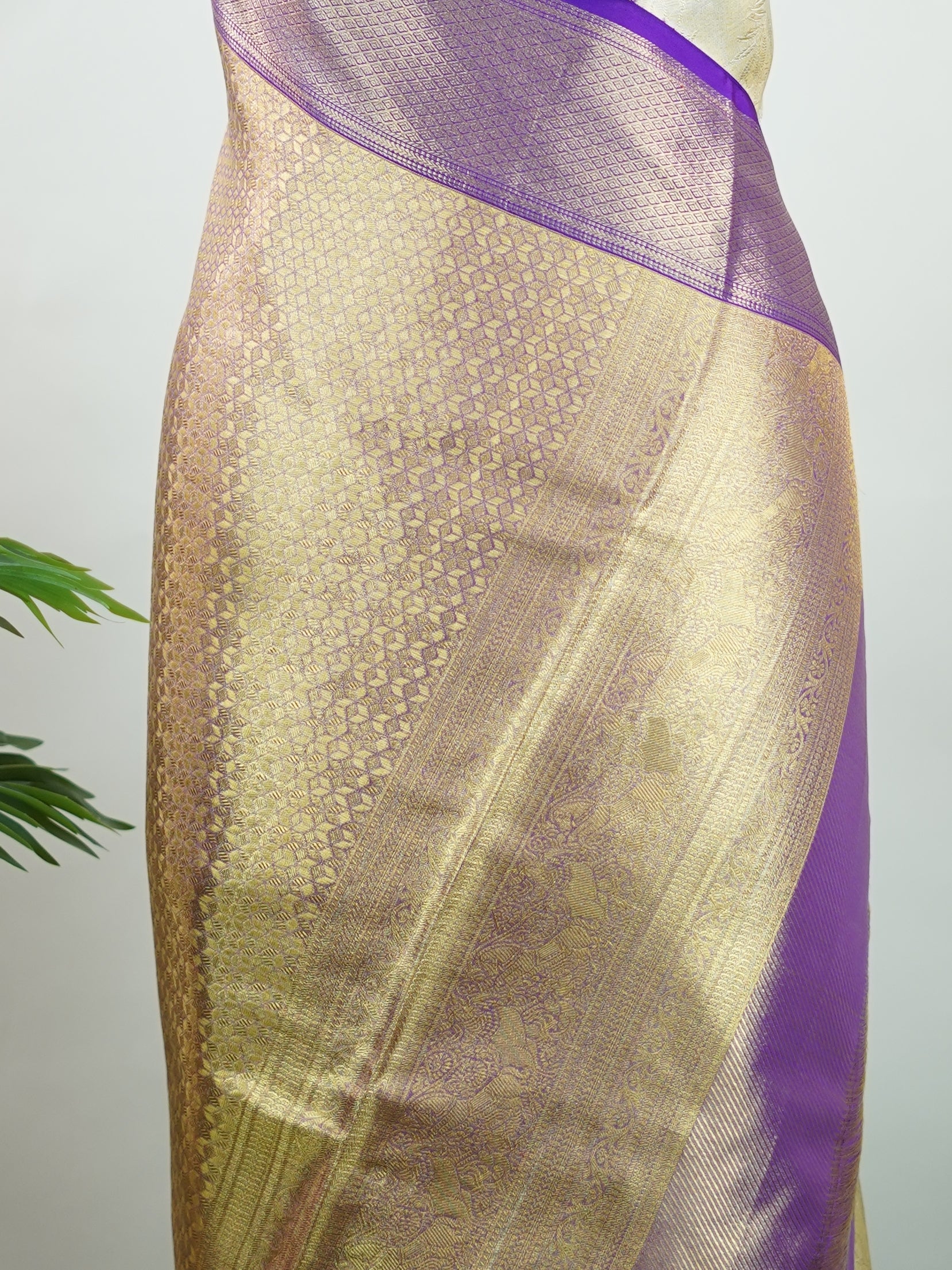 Kanchipuram Silk A classic cream silk saree with purple borders, adorned with delicate zari buttis scattered across the weave. The rich contrast blends tradition with grace. Woven in Kanchipuram from 100% pure silk, it's perfect for weddings and festive occasions. A timeless drape for treasured moments.                     #ManoranjithamSilks #KanjivaramHandloom #PureSilkSaree #BridalElegance #TimelessTradition Vagadeeshwari - Cream Pure Kanjivaram Silk Saree | Zari Buttas - Manoranjitham Weaves - Handloom 