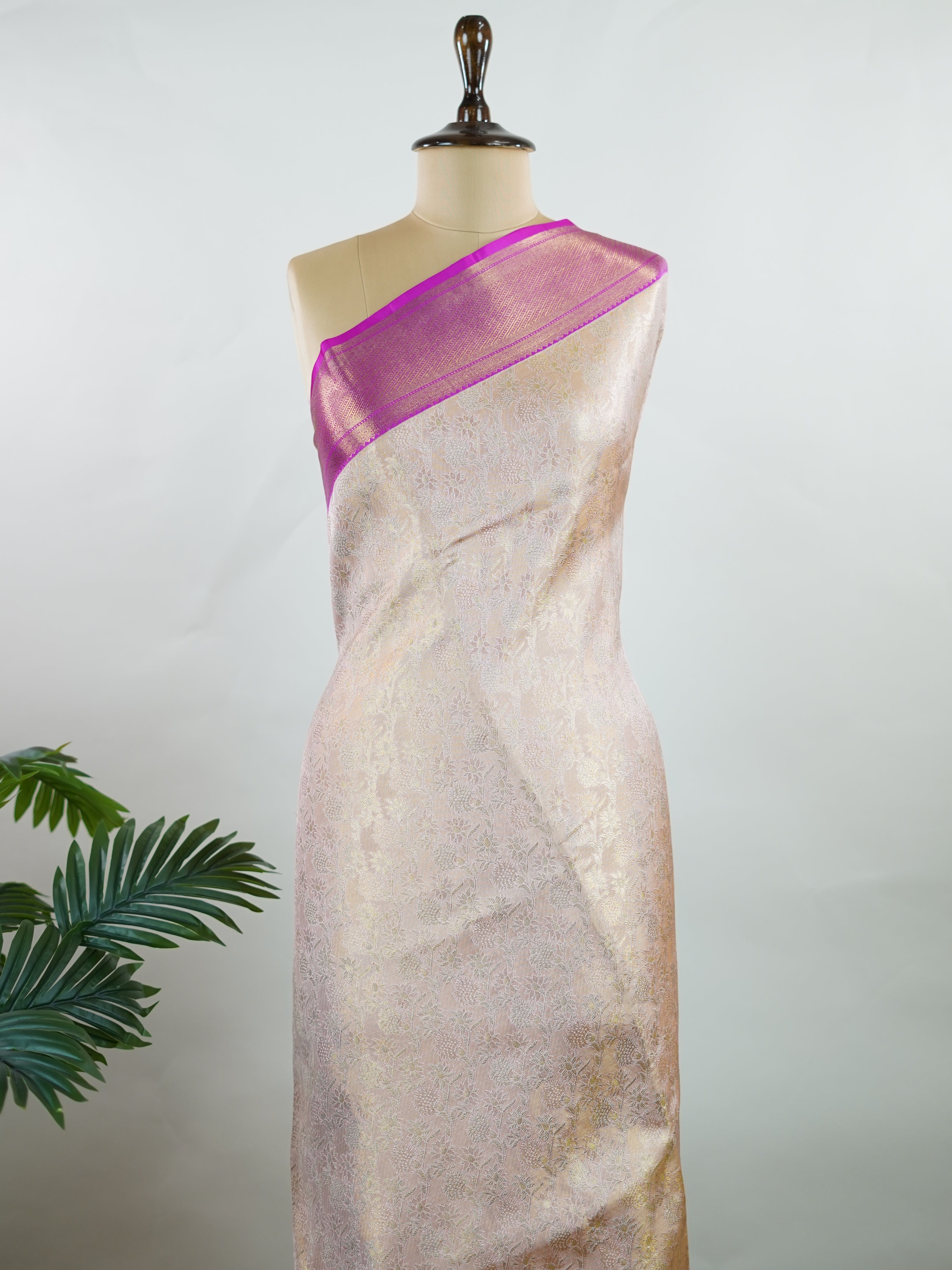 Kanchipuram Silk A subtle mauve silk saree with pink borders, woven with gold and silver zari buttas that shimmer in every fold. The soft hues bring elegance to timeless tradition. Handwoven in Kanchipuram with 100% pure silk, it's perfect for weddings and festive celebrations. A drape that carries beauty across generations.             #ManoranjithamSilks #KanjivaramHandloom #PureSilkSaree #BridalElegance #TimelessTradition Jayanthasri - Pure Kanjivaram Silk Saree | Zari Buttas - Manoranjitham Weaves - Han