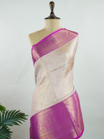 Kanchipuram Silk A subtle mauve silk saree with pink borders, woven with gold and silver zari buttas that shimmer in every fold. The soft hues bring elegance to timeless tradition. Handwoven in Kanchipuram with 100% pure silk, it's perfect for weddings and festive celebrations. A drape that carries beauty across generations.             #ManoranjithamSilks #KanjivaramHandloom #PureSilkSaree #BridalElegance #TimelessTradition Jayanthasri - Pure Kanjivaram Silk Saree | Zari Buttas - Manoranjitham Weaves - Han