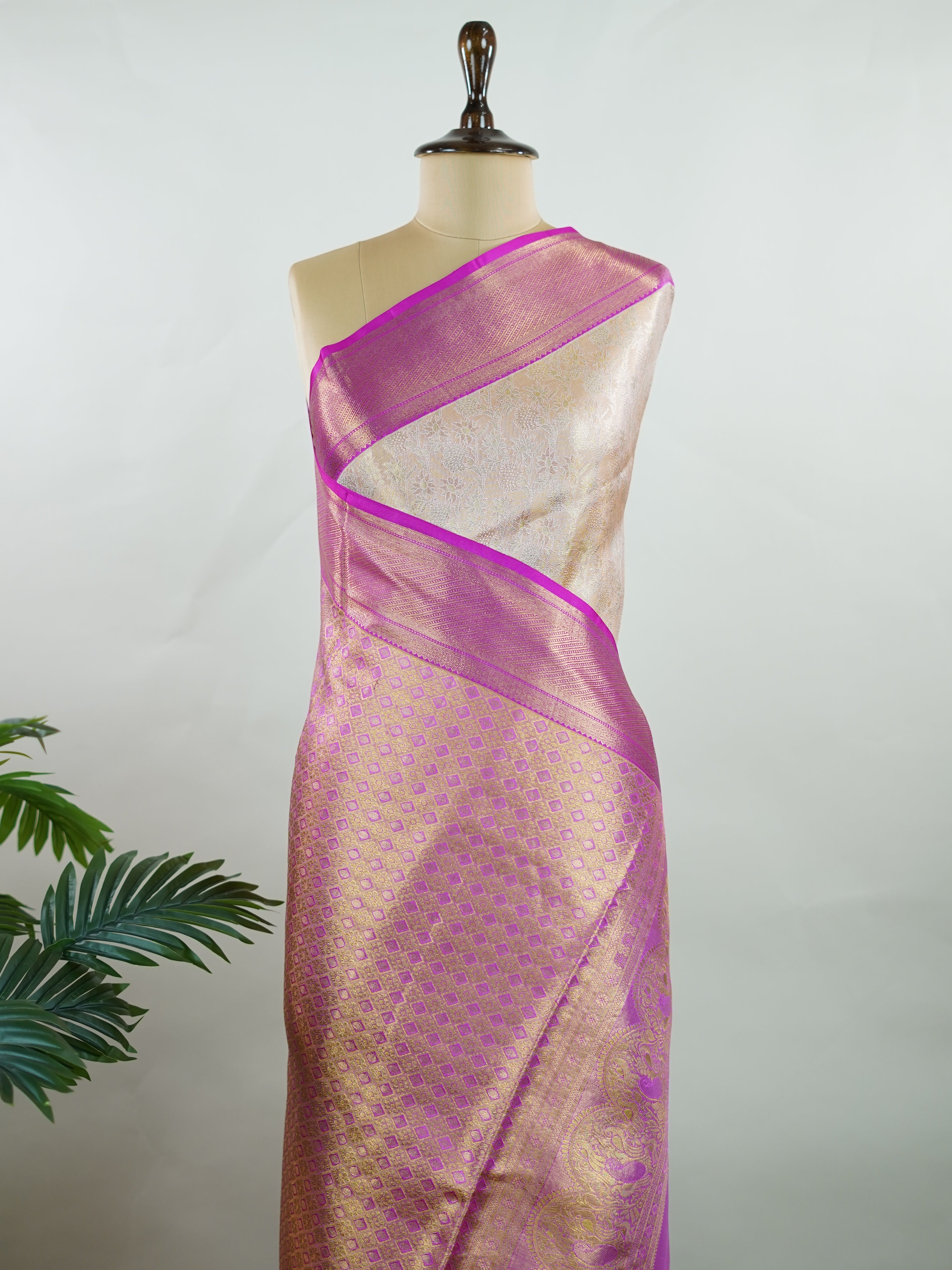 Kanchipuram Silk A subtle mauve silk saree with pink borders, woven with gold and silver zari buttas that shimmer in every fold. The soft hues bring elegance to timeless tradition. Handwoven in Kanchipuram with 100% pure silk, it's perfect for weddings and festive celebrations. A drape that carries beauty across generations.             #ManoranjithamSilks #KanjivaramHandloom #PureSilkSaree #BridalElegance #TimelessTradition Jayanthasri - Pure Kanjivaram Silk Saree | Zari Buttas - Manoranjitham Weaves - Han