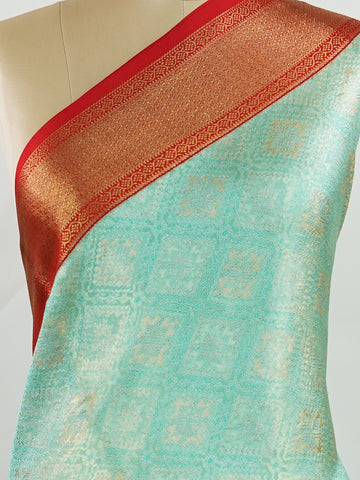 Kanchipuram Silk A rich green silk saree with bold red borders, adorned with gold and silver zari buttas that glimmer across the weave. The classic contrast reflects timeless tradition. Woven in Kanchipuram with 100% pure silk, it's perfect for weddings and special occasions. A drape that embodies heritage and grace.          #ManoranjithamSilks #KanjivaramHandloom #PureSilkSaree #BridalElegance #TimelessTradition Gowla - Green Pure Kanjivaram Silk Saree | Zari Buttas - Manoranjitham Weaves - Handloom Store