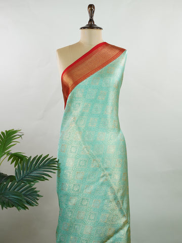 Kanchipuram Silk A rich green silk saree with bold red borders, adorned with gold and silver zari buttas that glimmer across the weave. The classic contrast reflects timeless tradition. Woven in Kanchipuram with 100% pure silk, it's perfect for weddings and special occasions. A drape that embodies heritage and grace.          #ManoranjithamSilks #KanjivaramHandloom #PureSilkSaree #BridalElegance #TimelessTradition Gowla - Green Pure Kanjivaram Silk Saree | Zari Buttas - Manoranjitham Weaves - Handloom Store