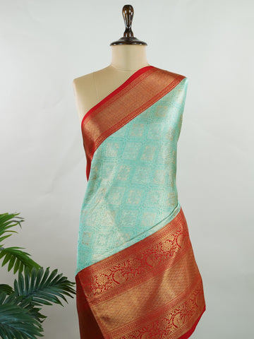 Kanchipuram Silk A rich green silk saree with bold red borders, adorned with gold and silver zari buttas that glimmer across the weave. The classic contrast reflects timeless tradition. Woven in Kanchipuram with 100% pure silk, it's perfect for weddings and special occasions. A drape that embodies heritage and grace.          #ManoranjithamSilks #KanjivaramHandloom #PureSilkSaree #BridalElegance #TimelessTradition Gowla - Green Pure Kanjivaram Silk Saree | Zari Buttas - Manoranjitham Weaves - Handloom Store