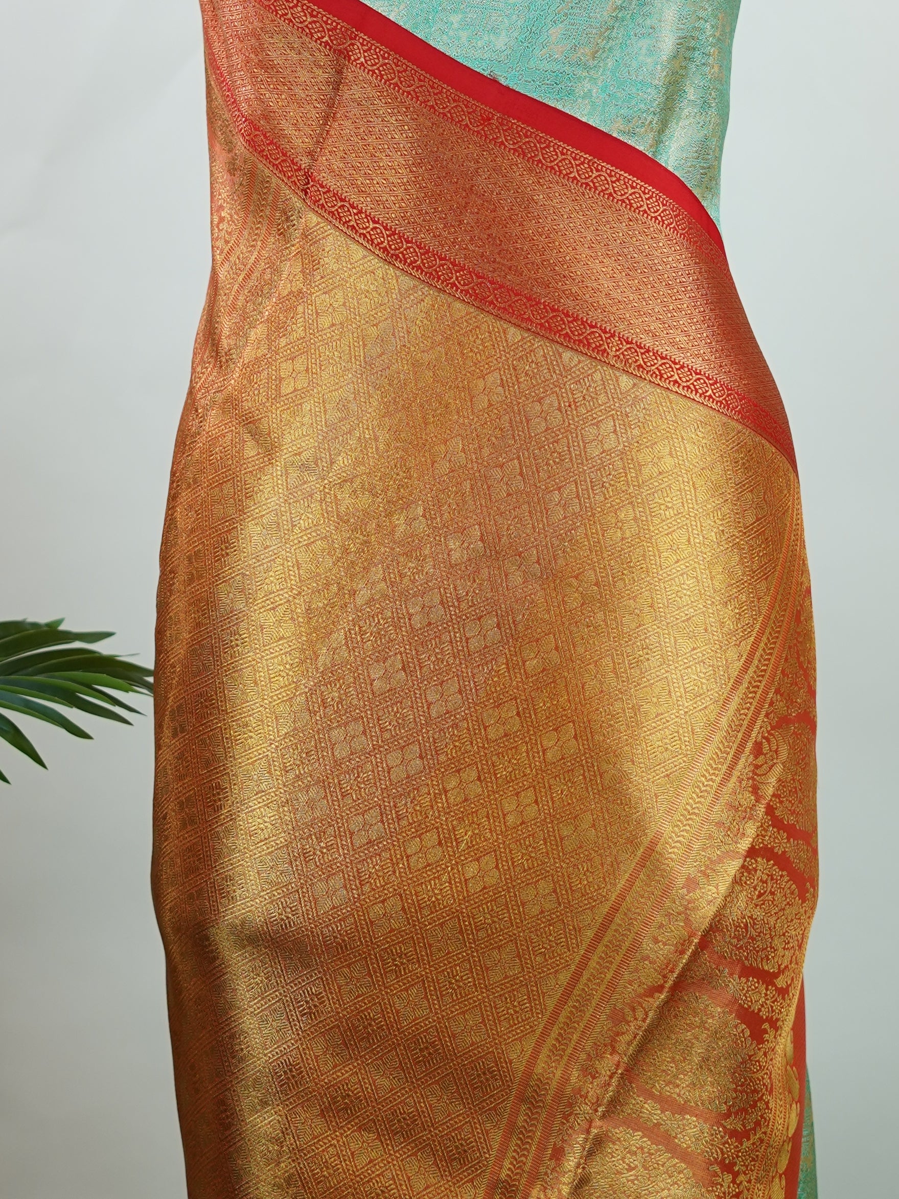 Kanchipuram Silk A rich green silk saree with bold red borders, adorned with gold and silver zari buttas that glimmer across the weave. The classic contrast reflects timeless tradition. Woven in Kanchipuram with 100% pure silk, it's perfect for weddings and special occasions. A drape that embodies heritage and grace.          #ManoranjithamSilks #KanjivaramHandloom #PureSilkSaree #BridalElegance #TimelessTradition Gowla - Green Pure Kanjivaram Silk Saree | Zari Buttas - Manoranjitham Weaves - Handloom Store