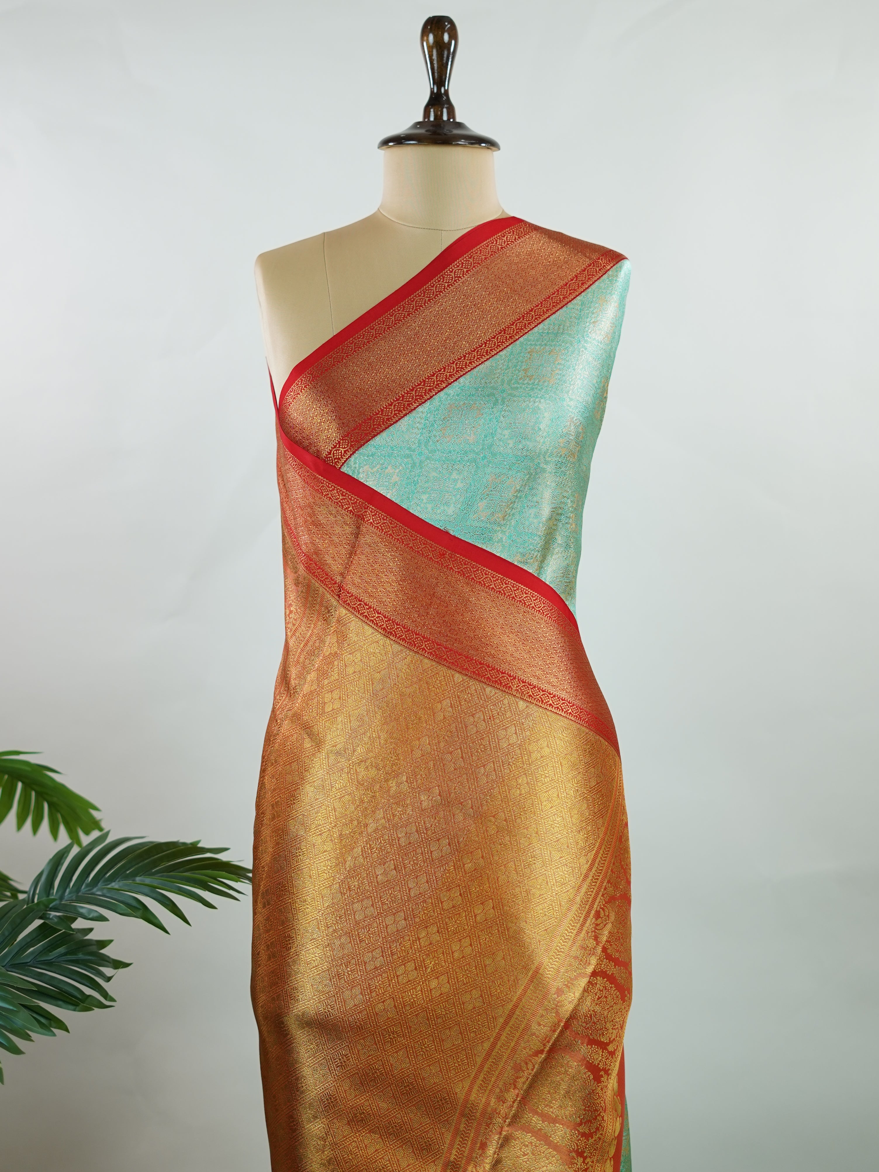 Kanchipuram Silk A rich green silk saree with bold red borders, adorned with gold and silver zari buttas that glimmer across the weave. The classic contrast reflects timeless tradition. Woven in Kanchipuram with 100% pure silk, it's perfect for weddings and special occasions. A drape that embodies heritage and grace.          #ManoranjithamSilks #KanjivaramHandloom #PureSilkSaree #BridalElegance #TimelessTradition Gowla - Green Pure Kanjivaram Silk Saree | Zari Buttas - Manoranjitham Weaves - Handloom Store