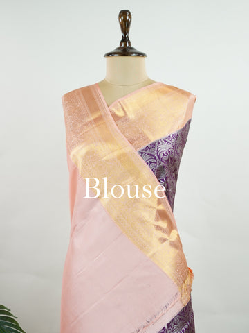 Kanchipuram Silk A rich dark magenta silk saree with peach borders, adorned with delicate silver zari buttas that glisten across the weave. The vibrant contrast exudes grace and tradition. Handwoven in Kanchipuram with 100% pure silk, it's perfect for weddings and festive celebrations. A timeless drape for treasured moments.                  #ManoranjithamSilks #KanjivaramHandloom #PureSilkSaree #BridalElegance #TimelessTradition Kuntalavarali - Magenta Pure Kanjivaram Silk Saree | Zari Buttas - Manoranjith