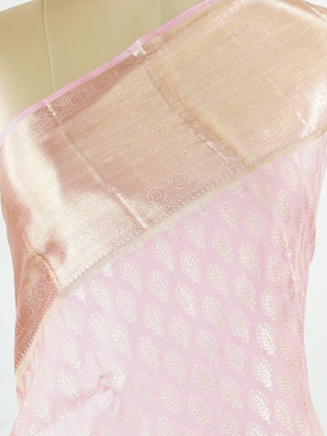 Kanchipuram Silk A delicate baby pink silk saree with matching baby pink borders, adorned with gold and silver zari buttas that shimmer softly. The monochrome palette exudes subtle elegance and grace. Handwoven in Kanchipuram with 100% pure silk, it's perfect for weddings and special celebrations. A timeless drape for moments to cherish.                #ManoranjithamSilks #KanjivaramHandloom #PureSilkSaree #BridalElegance #TimelessTradition Hindolam - Pink Pure Kanjivaram Silk Saree | Zari Buttas - Manoranj