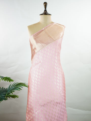 Kanchipuram Silk A delicate baby pink silk saree with matching baby pink borders, adorned with gold and silver zari buttas that shimmer softly. The monochrome palette exudes subtle elegance and grace. Handwoven in Kanchipuram with 100% pure silk, it's perfect for weddings and special celebrations. A timeless drape for moments to cherish.                #ManoranjithamSilks #KanjivaramHandloom #PureSilkSaree #BridalElegance #TimelessTradition Hindolam - Pink Pure Kanjivaram Silk Saree | Zari Buttas - Manoranj