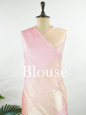 Kanchipuram Silk A delicate baby pink silk saree with matching baby pink borders, adorned with gold and silver zari buttas that shimmer softly. The monochrome palette exudes subtle elegance and grace. Handwoven in Kanchipuram with 100% pure silk, it's perfect for weddings and special celebrations. A timeless drape for moments to cherish.                #ManoranjithamSilks #KanjivaramHandloom #PureSilkSaree #BridalElegance #TimelessTradition Hindolam - Pink Pure Kanjivaram Silk Saree | Zari Buttas - Manoranj