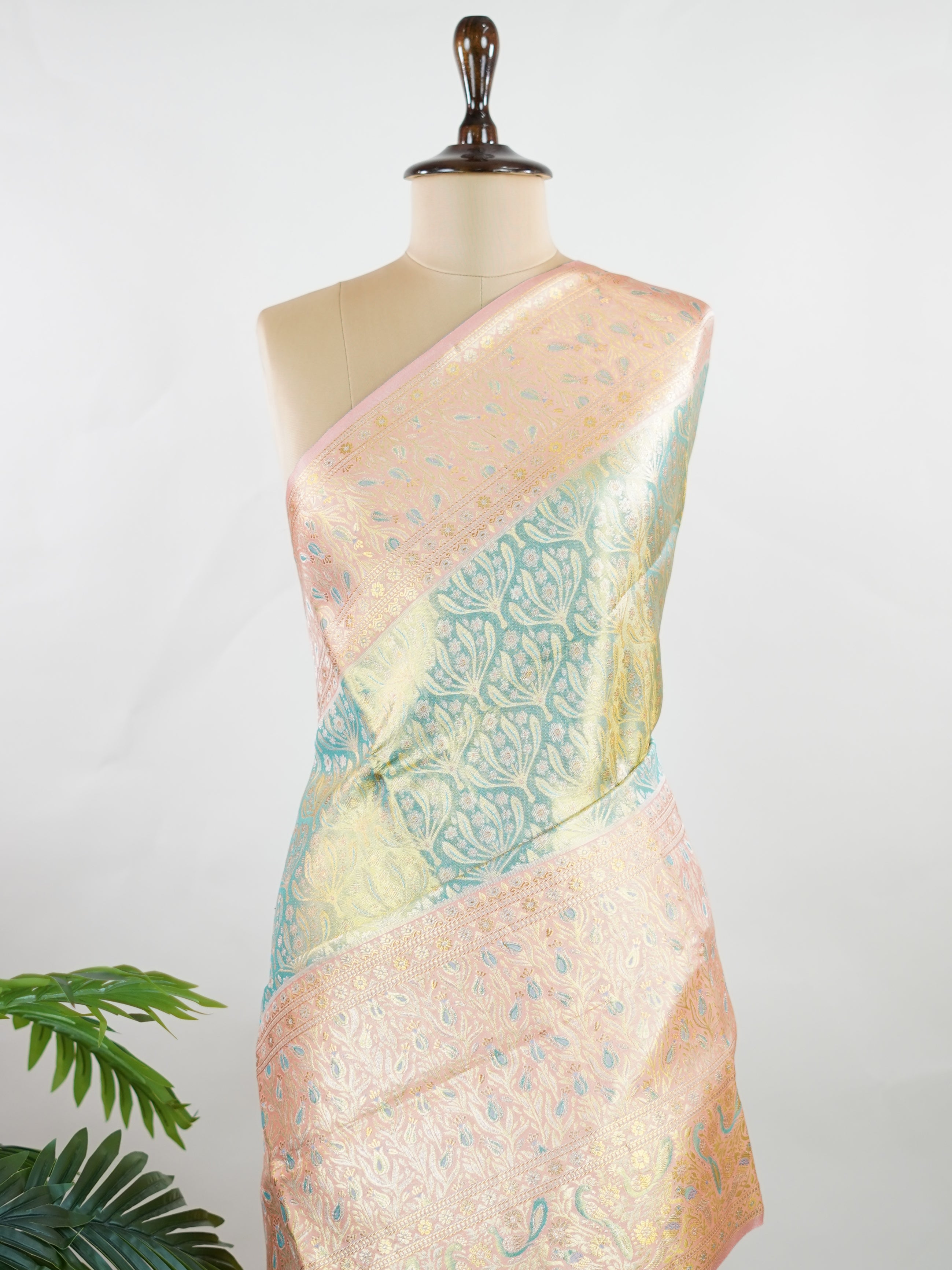 Kanchipuram Silk A refreshing green silk saree with light orange borders, adorned with gold and silver zari buttas that shimmer in gentle elegance. The vibrant contrast blends festive beauty with timeless tradition. Handwoven in Kanchipuram with 100% pure silk, it's perfect for weddings and special occasions. A drape that carries grace across generations.                #ManoranjithamSilks #KanjivaramHandloom #PureSilkSaree #BridalElegance #TimelessTradition Niroshtaa - Green Pure Kanjivaram Silk Saree | Za