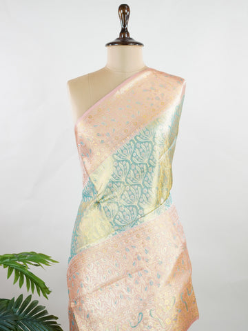 Kanchipuram Silk A refreshing green silk saree with light orange borders, adorned with gold and silver zari buttas that shimmer in gentle elegance. The vibrant contrast blends festive beauty with timeless tradition. Handwoven in Kanchipuram with 100% pure silk, it's perfect for weddings and special occasions. A drape that carries grace across generations.                #ManoranjithamSilks #KanjivaramHandloom #PureSilkSaree #BridalElegance #TimelessTradition Niroshtaa - Green Pure Kanjivaram Silk Saree | Za
