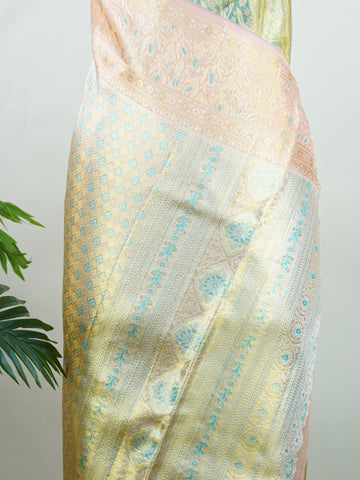 Kanchipuram Silk A refreshing green silk saree with light orange borders, adorned with gold and silver zari buttas that shimmer in gentle elegance. The vibrant contrast blends festive beauty with timeless tradition. Handwoven in Kanchipuram with 100% pure silk, it's perfect for weddings and special occasions. A drape that carries grace across generations.                #ManoranjithamSilks #KanjivaramHandloom #PureSilkSaree #BridalElegance #TimelessTradition Niroshtaa - Green Pure Kanjivaram Silk Saree | Za
