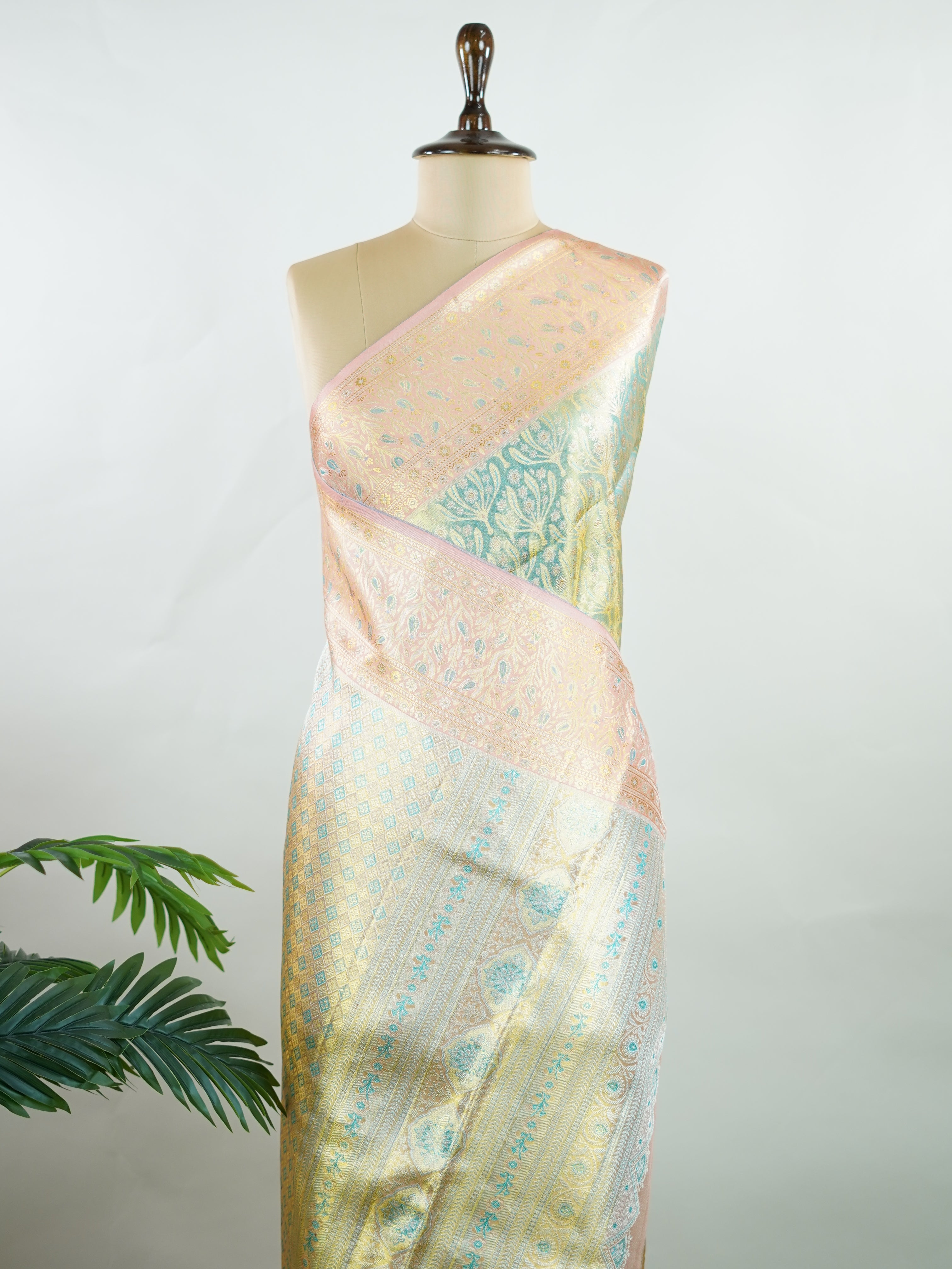 Kanchipuram Silk A refreshing green silk saree with light orange borders, adorned with gold and silver zari buttas that shimmer in gentle elegance. The vibrant contrast blends festive beauty with timeless tradition. Handwoven in Kanchipuram with 100% pure silk, it's perfect for weddings and special occasions. A drape that carries grace across generations.                #ManoranjithamSilks #KanjivaramHandloom #PureSilkSaree #BridalElegance #TimelessTradition Niroshtaa - Green Pure Kanjivaram Silk Saree | Za
