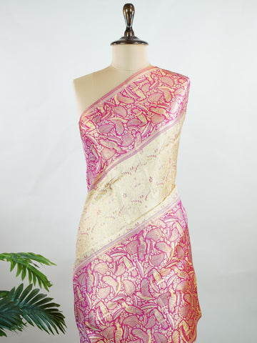 Kanchipuram Silk A classic cream silk saree with vibrant red borders, adorned with gold zari buttas that shimmer across the weave. The timeless contrast blends grace with festive splendour. Handwoven in Kanchipuram with 100% pure silk, it's perfect for weddings and special occasions. A drape that celebrates beauty and tradition.                    #ManoranjithamSilks #KanjivaramHandloom #PureSilkSaree #BridalElegance #TimelessTradition Rasikapriya - Cream Pure Kanjivaram Silk Saree | Zari Buttas - Manoranji