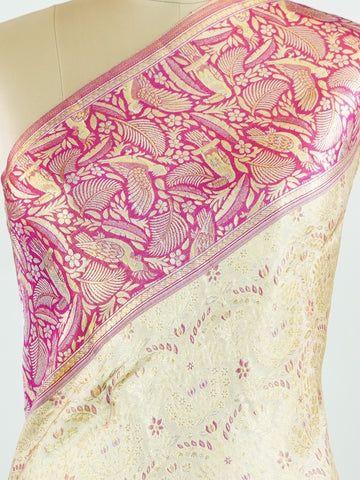 Kanchipuram Silk A classic cream silk saree with vibrant red borders, adorned with gold zari buttas that shimmer across the weave. The timeless contrast blends grace with festive splendour. Handwoven in Kanchipuram with 100% pure silk, it's perfect for weddings and special occasions. A drape that celebrates beauty and tradition.                    #ManoranjithamSilks #KanjivaramHandloom #PureSilkSaree #BridalElegance #TimelessTradition Rasikapriya - Cream Pure Kanjivaram Silk Saree | Zari Buttas - Manoranji