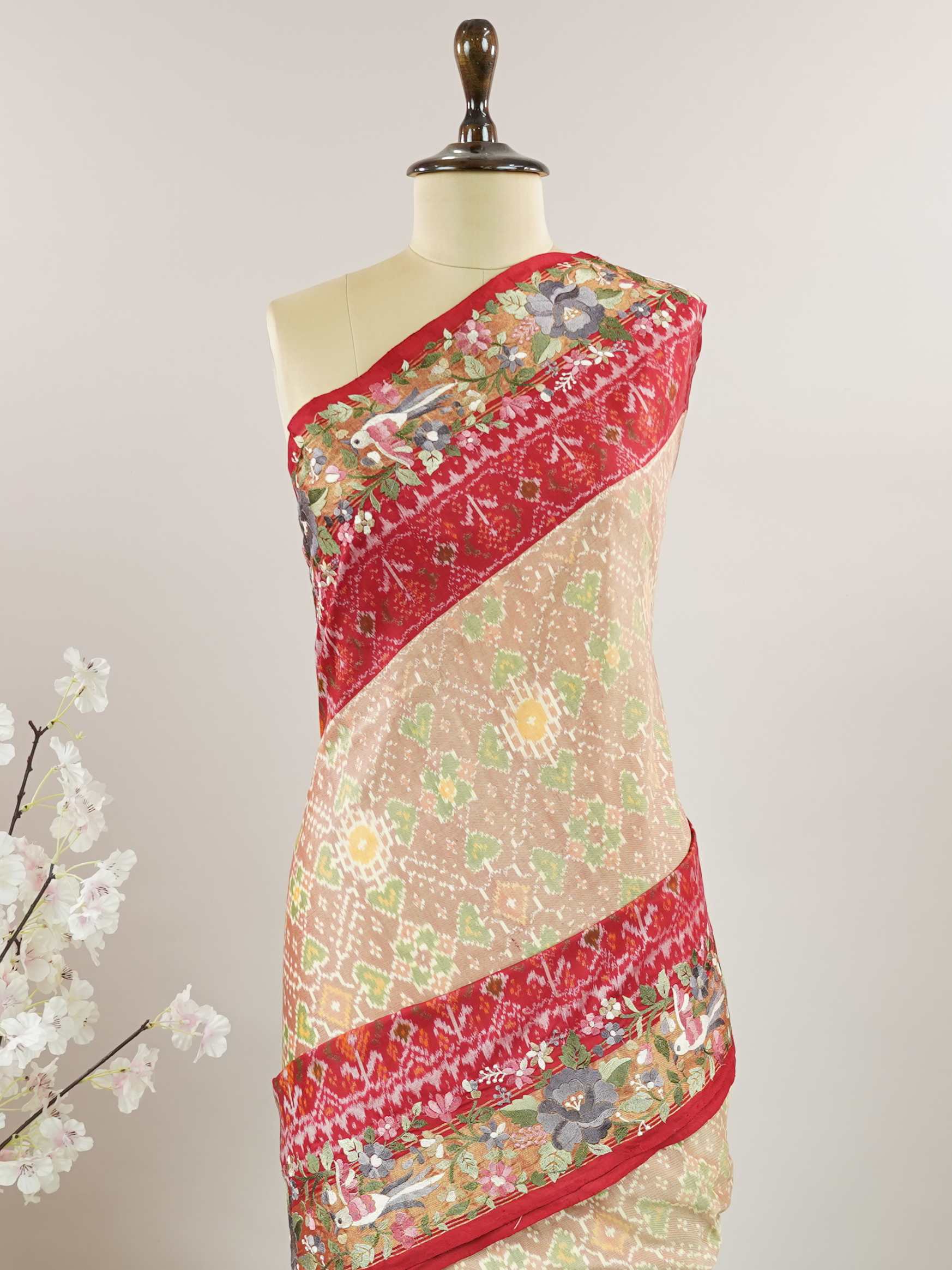 Pochampally Pochampally silks carry vibrant ikkat patterns, now graced with hand-embroidered Parsi Gara.br
A rare fusion of tradition and timeless elegance. Maha Kali - Handwork Embroidered Silk Saree | Ikkat Border - Manoranjitham Weaves - Handloom Store