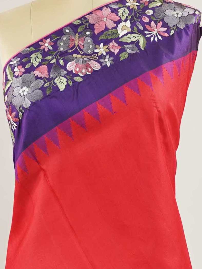 Gadwal Silk Bright red silk with deep blue borders, graced by fine embroidery. Striking contrast for weddings and special events. The soft silk moves effortlessly with every step. A saree that blends drama with tradition. #RedBlueSaree #GadwalSilk #NoZari #HeritageWeaves Hamsanandi - Bright Red Handwork Embroidered Silk Saree | Parsigara Embroidery - Manoranjitham Weaves - Handloom Store