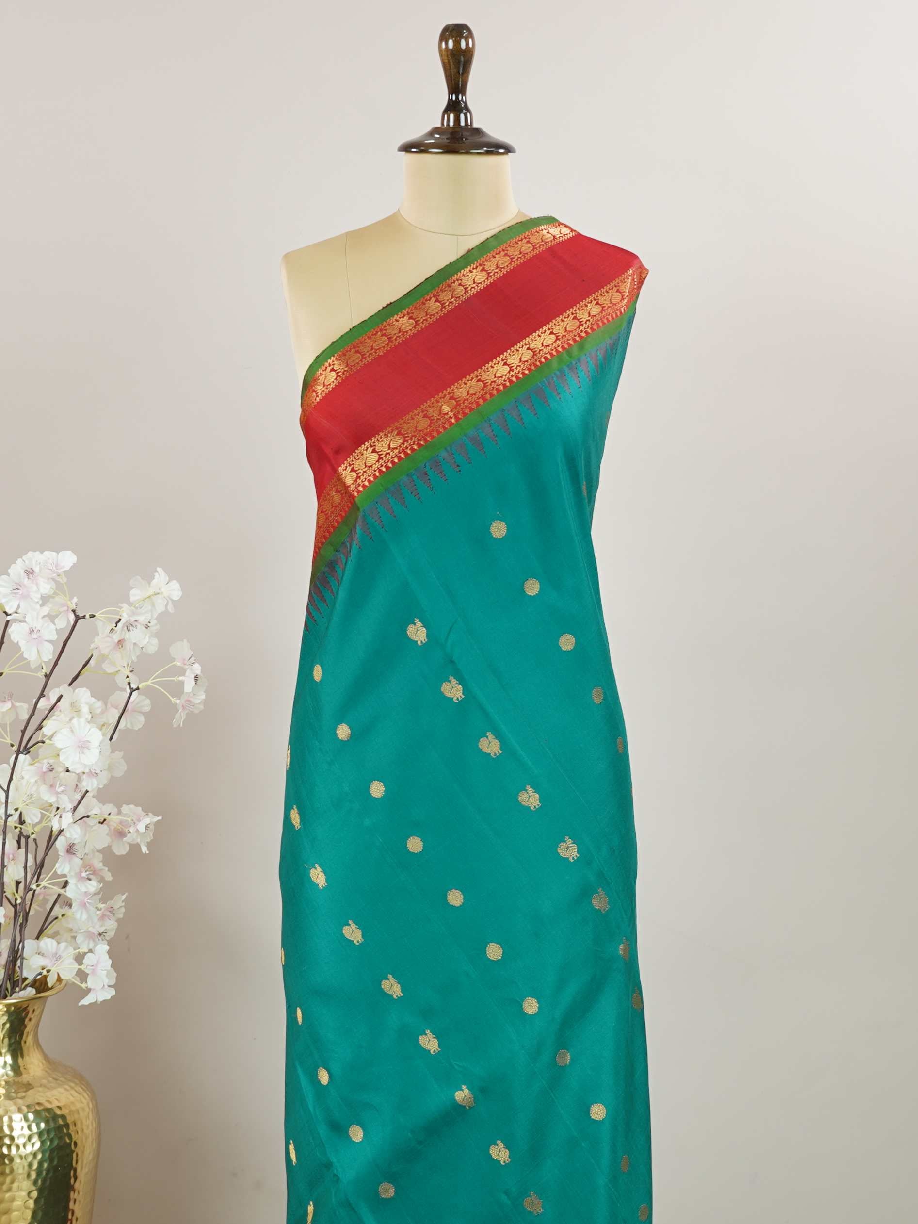 Gadwal Silk Gadwal handlooms are where simplicity meets regal artistry. Their contrast borders and rich pallus embody cultural pride. Charumati - Handloom Gadwal Silk Saree | Pure Silk | Zari Border - Manoranjitham Weaves - Handloom Store