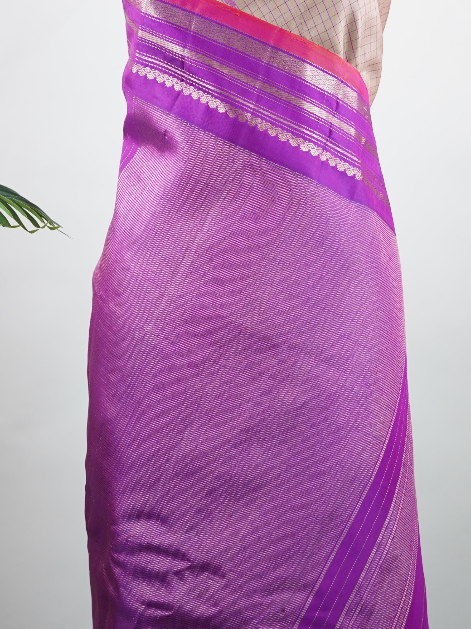 Gadwal Silk This elegant Gadwal saree features a beige body paired with a magenta pink border, crafted from 100% pure silk.br
The body is adorned with subtle stripes, adding a refined texture and charm.br
Finished with a delicate zari and thread border, it showcases the timeless handloom artistry of Gadwal weaving. Maheshwari - Beige Handloom Gadwal Silk Saree | Pure Silk | Zari Border - Manoranjitham Weaves - Handloom Store