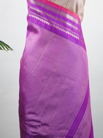 Gadwal Silk This elegant Gadwal saree features a beige body paired with a magenta pink border, crafted from 100% pure silk.br
The body is adorned with subtle stripes, adding a refined texture and charm.br
Finished with a delicate zari and thread border, it showcases the timeless handloom artistry of Gadwal weaving. Maheshwari - Beige Handloom Gadwal Silk Saree | Pure Silk | Zari Border - Manoranjitham Weaves - Handloom Store