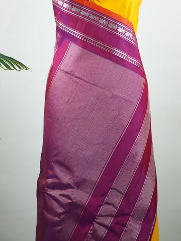 Gadwal Silk This vibrant Gadwal saree features a yellow body paired with a magenta pink border, crafted from 100% pure silk.br
The body is adorned with delicate resham checks, adding texture and understated elegance.br
Finished with a graceful gap border, it beautifully showcases the timeless handloom artistry of Gadwal weaving. Shankari - Yellow Handloom Gadwal Silk Saree | Pure Silk | Zari Border - Manoranjitham Weaves - Handloom Store