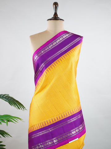 Gadwal Silk This elegant Gadwal saree features a yellow body paired with a magenta pink border, crafted from 100% pure silk.br
The plain body offers a clean, sophisticated look, perfect for any occasion.br
Finished with a graceful gap border, it highlights the timeless handloom craftsmanship of Gadwal weaving. Sreekari - Yellow Handloom Gadwal Silk Saree | Pure Silk | Zari Border - Manoranjitham Weaves - Handloom Store