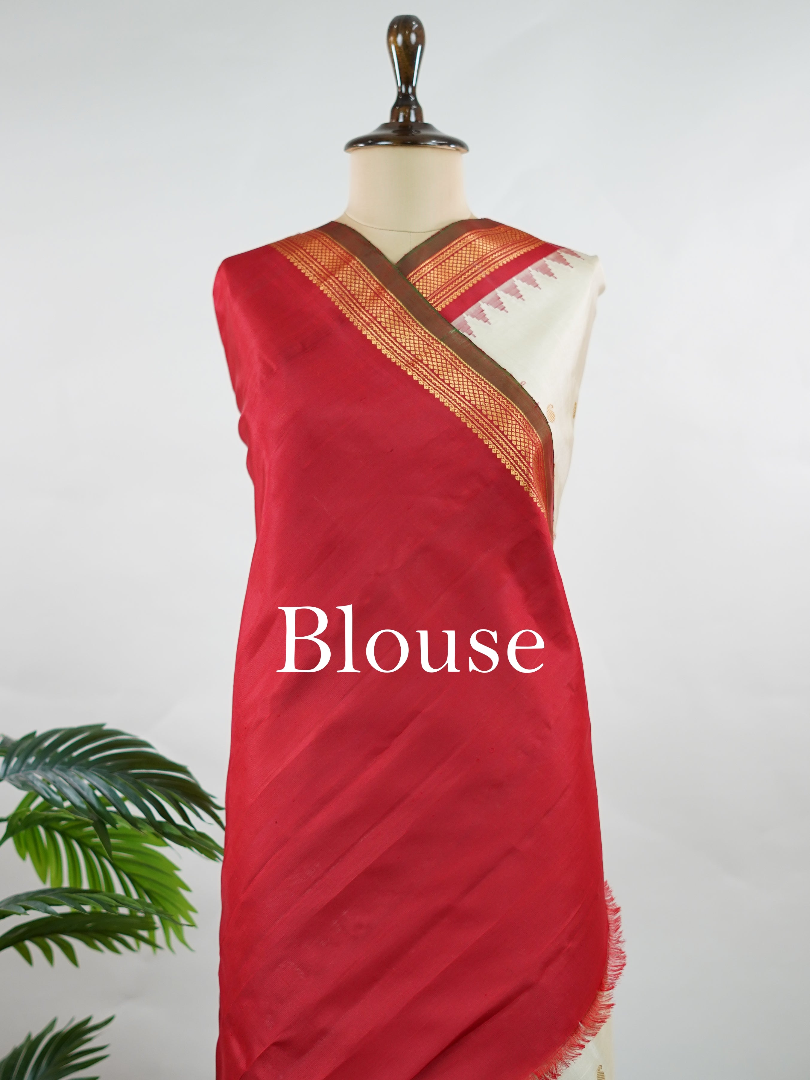 Gadwal Silk This elegant Gadwal saree features a beige body paired with a red border, crafted from 100% pure silk.br
The body is adorned with delicate gold mango and rudraksha buttis, adding a touch of traditional charm.br
Finished with a subtle small border, it showcases the exquisite handloom artistry of Gadwal weaving. Mangala - Beige Handloom Gadwal Silk Saree | Pure Silk | Zari Border - Manoranjitham Weaves - Handloom Store