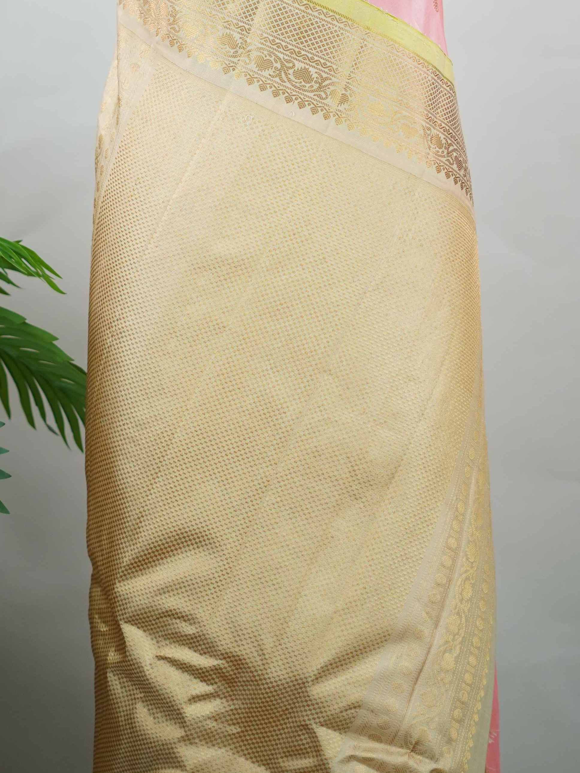 Gadwal Silk Embrace soft elegance with this Gadwal saree in a delicate baby pink shade, paired with a graceful beige blouse. /spanspanThe design is enriched with elegant gold and silver buttas that add a subtle festive glow. /spanspanIts traditional weave offers a refined drape that beautifully blends charm and sophistication. /spanspanPerfect for festive occasions, celebrations, and special gatherings that call for timeless grace. Shashwati - Handloom Gadwal Silk Saree | Pure Silk | Zari Border - Manoranji